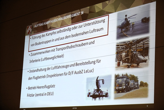 Präsentationsfolie zum Auftrag des Kampfhubschrauberregiments 36 mit Fotos von Tiger-Hubschraubern, Radar und Militär-LKW.